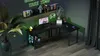 A gaming desk setup in a room with neon green lighting. Produktbild-Vorschau