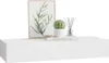 A white floating shelf with decorative items on it. Anteprima dell’immagine prodotto