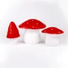 Three mushroom-shaped lamps of varying sizes are displayed against a white background. Produktbild-Vorschau
