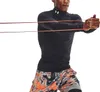 A man is performing a resistance band exercise. Produktbild-Vorschau