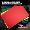 A stack of colorful plastic cutting boards on a dark, textured surface. Produktbild-Vorschau