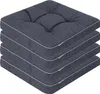 A stack of four dark gray seat cushions with light gray piping. Podgląd zdjęcia produktu