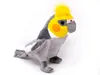 A plush toy of a cockatiel bird is shown against a white background. Produktbild-Vorschau