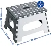 A gray and white folding stool with polka dots and dimensions indicated by blue lines and text. Podgląd zdjęcia produktu