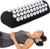 A woman is lying down with her head resting on an acupressure pillow. Anteprima dell’immagine prodotto
