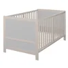 A baby crib is shown from a slightly elevated side angle against a white background. Produktbild-Vorschau