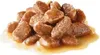 A pile of wet cat food pieces in gravy. Produktbild-Vorschau