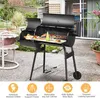A charcoal grill with food cooking on it, placed on a patio. Náhled obrázku produktu
