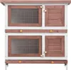 A two-tiered wooden rabbit hutch with four doors, two of which are wire mesh and two are solid wood. Náhľad obrázku produktu