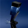 A lightning bolt-shaped perfume bottle with blue liquid inside, set against a blue gradient background with shattered glass effects at the base. Náhľad obrázku produktu