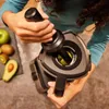 A person is using a blender with fruits nearby. Produktbild-Vorschau