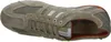 A top-down view of a beige Geox sneaker with orange accents. Produktbild-Vorschau