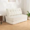 A white sofa bed is shown in a room with a wooden floor and a white wall. Produktbild-Vorschau