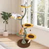 A cat tree with multiple platforms and toys, with three cats on it, placed near a window with natural light. Podgląd zdjęcia produktu