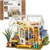 A miniature greenhouse model kit, with the packaging box shown above it. Anteprima dell’immagine prodotto