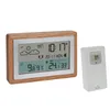 A digital weather station with a wooden frame and a separate wireless sensor, displayed on a white background. Podgląd zdjęcia produktu