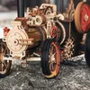 Close-up of a wooden mechanical steam engine model. Voir les images du produit