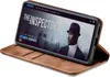 A smartphone in a brown flip case is displayed on a white background, showing a movie streaming interface on its screen. Produktbild-Vorschau