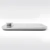 A side view of a silver kitchen scale with a silver dial on a white background. Anteprima dell’immagine prodotto