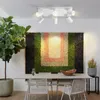 A dining room with a modern ceiling light fixture above a table. Produktbild-Vorschau