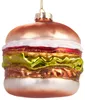 A glass ornament shaped like a hamburger, hanging from a gold string. Voir les images du produit