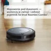A robot vacuum cleaner on a wooden floor with text overlay. Voir les images du produit