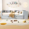 A child's bedroom with a light blue daybed, toys on a rug, and decorations on the wall. Podgląd zdjęcia produktu