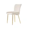 A single beige upholstered chair with gold legs is shown against a white background. Podgląd zdjęcia produktu