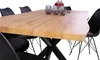 A dining table with chairs around it, set in a studio with a white background. Produktbild-Vorschau