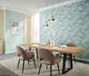 A dining room with a wooden table and chairs, set for a meal, with decorative wallpaper. Produktbild-Vorschau