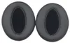 Two black ear pads for headphones are shown against a white background. Voir les images du produit