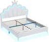 A white bed frame with a shell-shaped headboard and a crown detail, illuminated by blue LED lights. Náhľad obrázku produktu