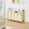A bedroom scene with a laundry sorter and a mirror. Anteprima dell’immagine prodotto