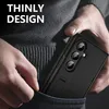 A person is putting a black phone case into their pocket. Produktbild-Vorschau