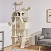 A multi-level cat tree with several cats on it, placed in a room with a sofa and a framed picture on the wall. Podgląd zdjęcia produktu