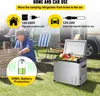 A camping refrigerator is shown outdoors with people and a camper van in the background, illustrating its use in a recreational setting. Produktbild-Vorschau