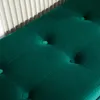 A close-up view of a tufted green velvet bench. Náhled obrázku produktu