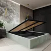 A bedroom with a bed frame that has its storage compartment open. Produktbild-Vorschau