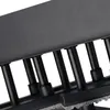 A close-up view of a black metal ceiling lamp with multiple vertical supports. Náhled obrázku produktu