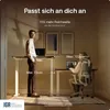 Two people using adjustable standing desks in a modern office setting. Voir les images du produit