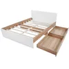 A disassembled wooden and white bed frame with two drawers pulled out. Produktbild-Vorschau