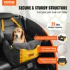 A dog sitting in a car seat designed for pets. Náhled obrázku produktu