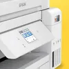 Close-up of a white Epson EcoTank printer, showing the control panel and ink tanks. Podgląd zdjęcia produktu