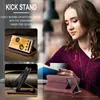 A woman is reading a book while holding a phone in a case with a kickstand. Produktbild-Vorschau