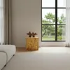 A modern living room with a large window overlooking a garden, featuring a minimalist decor with a white sofa and a wooden decorative column. Produktbild-Vorschau