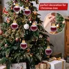 Christmas tree decorated with ornaments, with gifts underneath. Produktbild-Vorschau