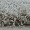 A close-up view of a shaggy rug with a high pile. Náhľad obrázku produktu