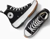 A pair of black Converse high-top sneakers with white laces and thick white soles, placed on a light gray and white background. Náhled obrázku produktu