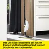 A steam cleaner is shown standing upright on a floor in a kitchen-like setting. Voir les images du produit