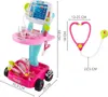 A pink toy doctor's cart with various medical accessories and a stethoscope, with dimensions indicated by measurement lines and text. Náhľad obrázku produktu